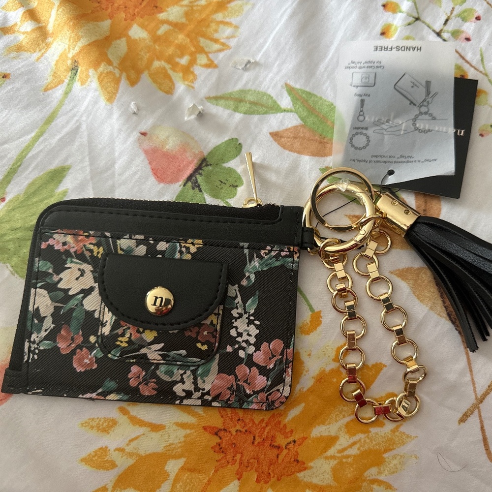 Card case with bracelet, key ring, and pocket for Apple air tag